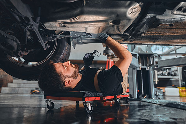 mechanic under the chassis